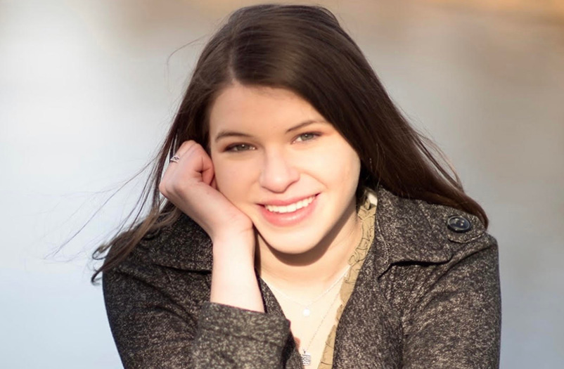 A closeup headshot of a young woman.